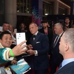 Daniel Craig takes selfies with fans at the BFI London Film Festival closing night gala for "Glass Onion: A Knives Out Mystery" at The Royal Festival Hall